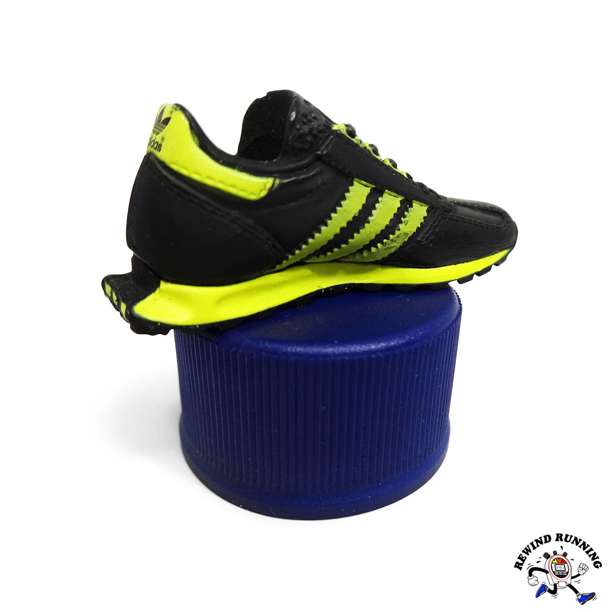 Black and yellow adidas Formel 1 sneaker running shoe with a brand logo in the corner.