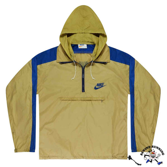 Nike vintage windbreaker jacket with beige tan hood and blue striped sleeves on a white background
