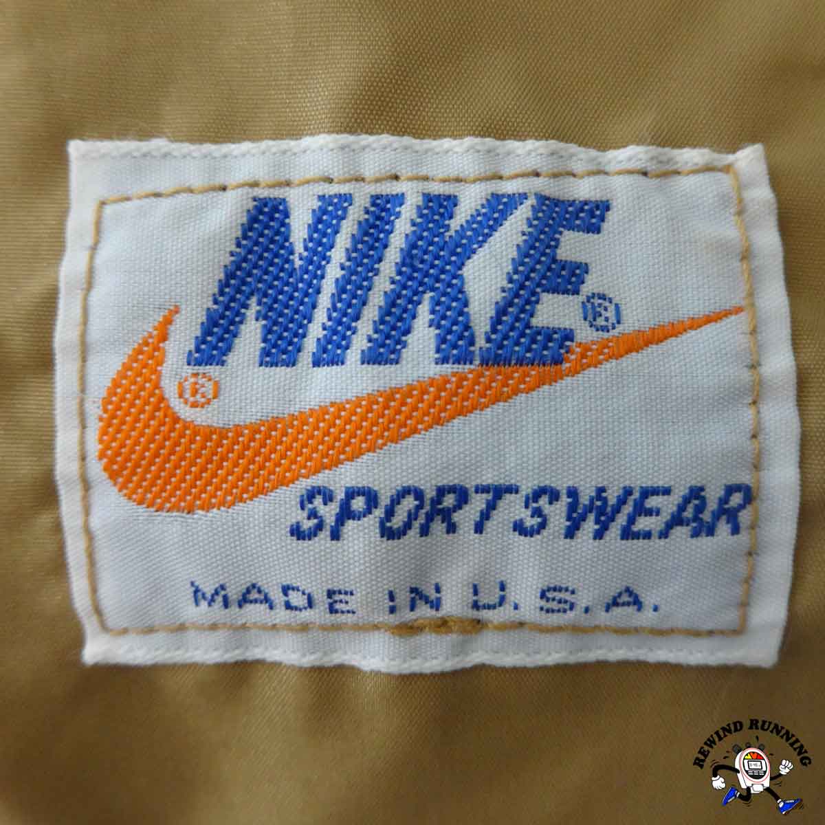 Nike Sportswear Made in USA label on a brown background