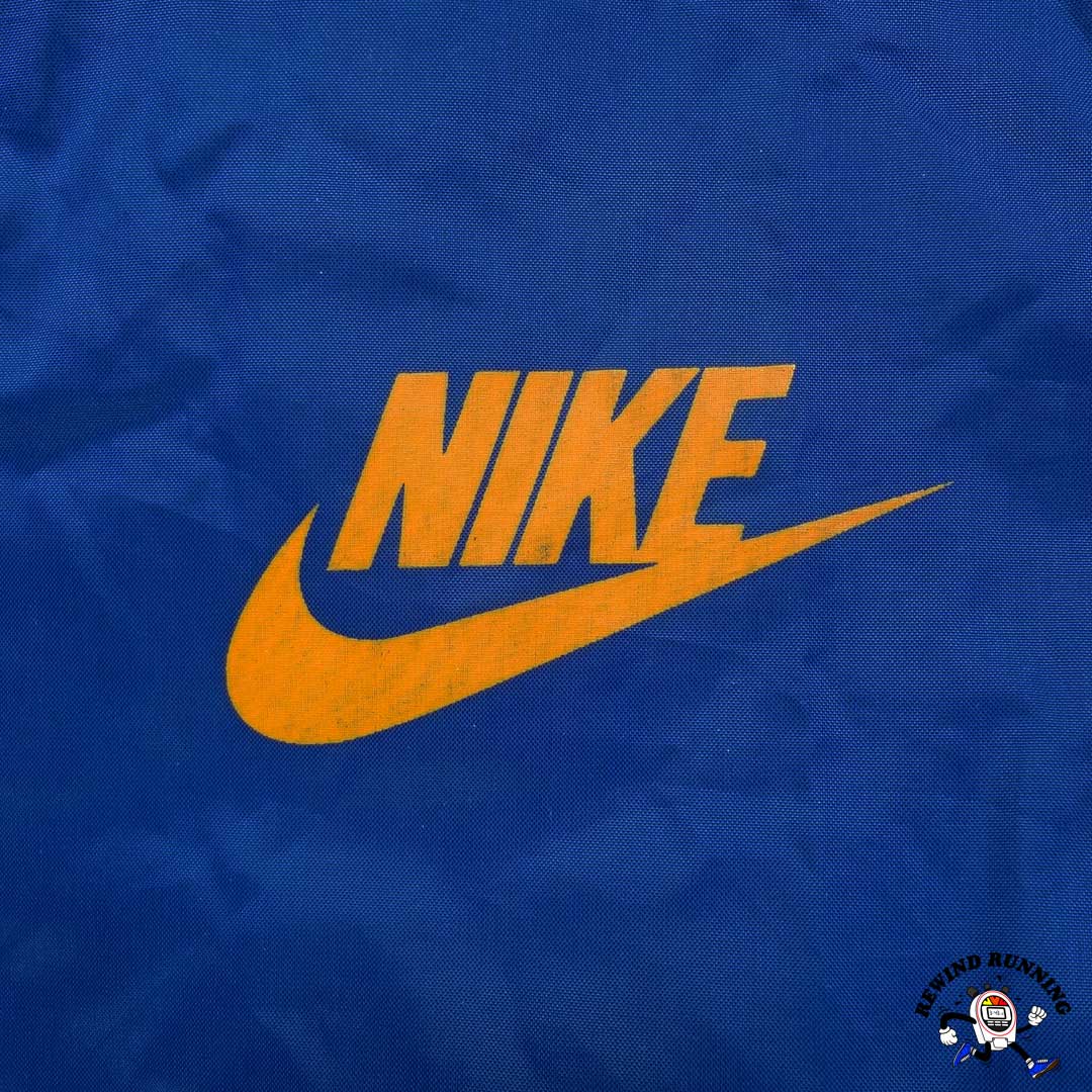 Nike Vintage Men's S 'Orange Tag' Blue Orange Windbreaker 70s 80s Zip Pullover Track Jacket front Nike Swoosh Logo