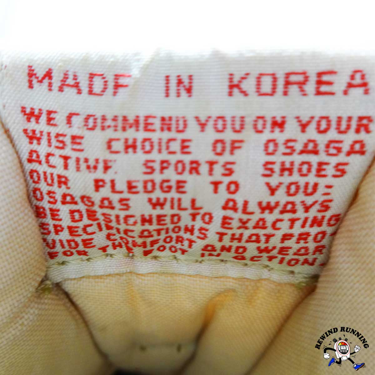 Text on a shoe label indicating 'Made in Korea' and product details.