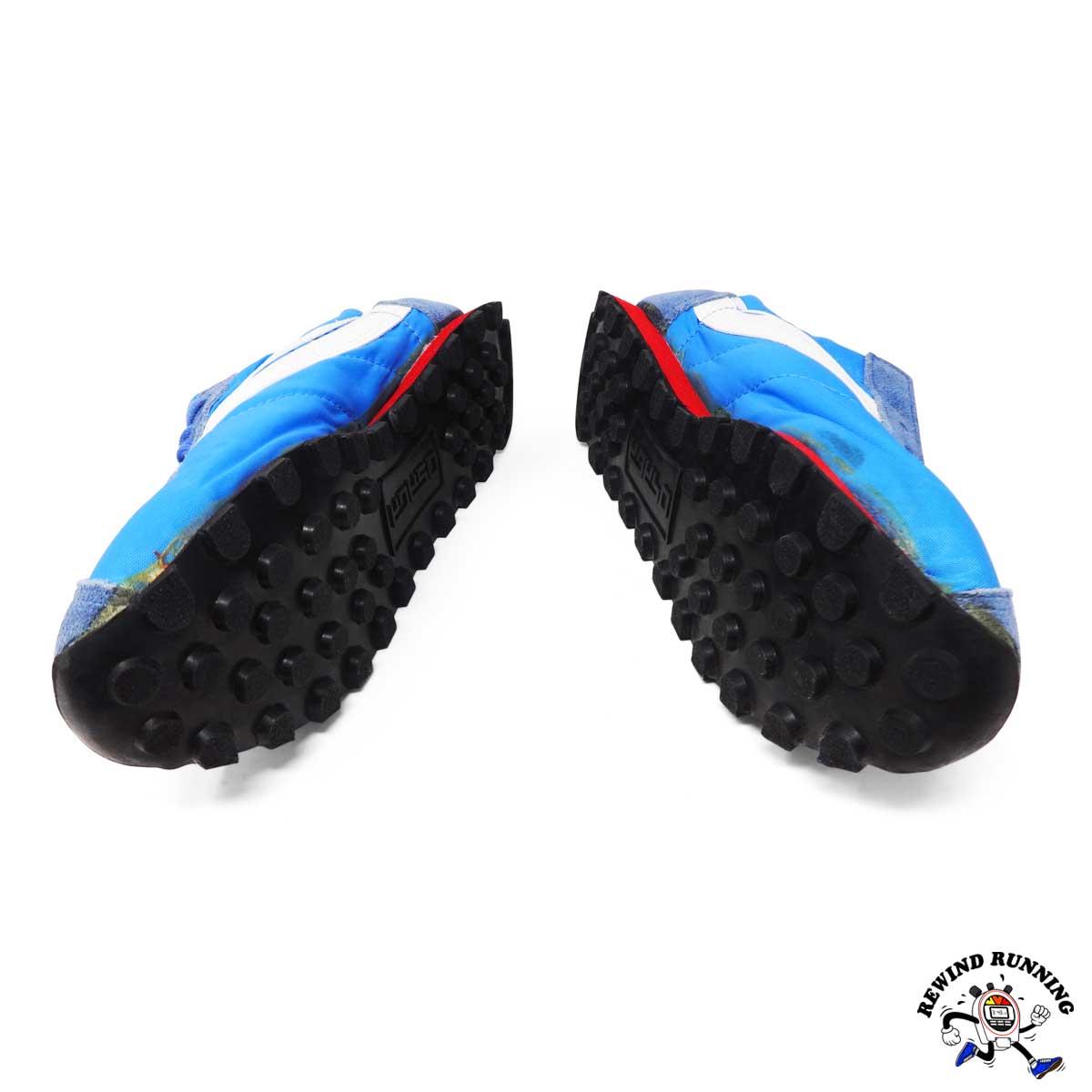 Blue and black shoes with red accents on a white background