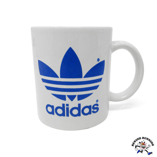 Vintage adidas Trefoil Logo 12 oz ceramic coffee mug. White with blue adidas logo.